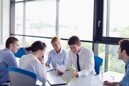 Group of happy young  business people in a meeting at office-1